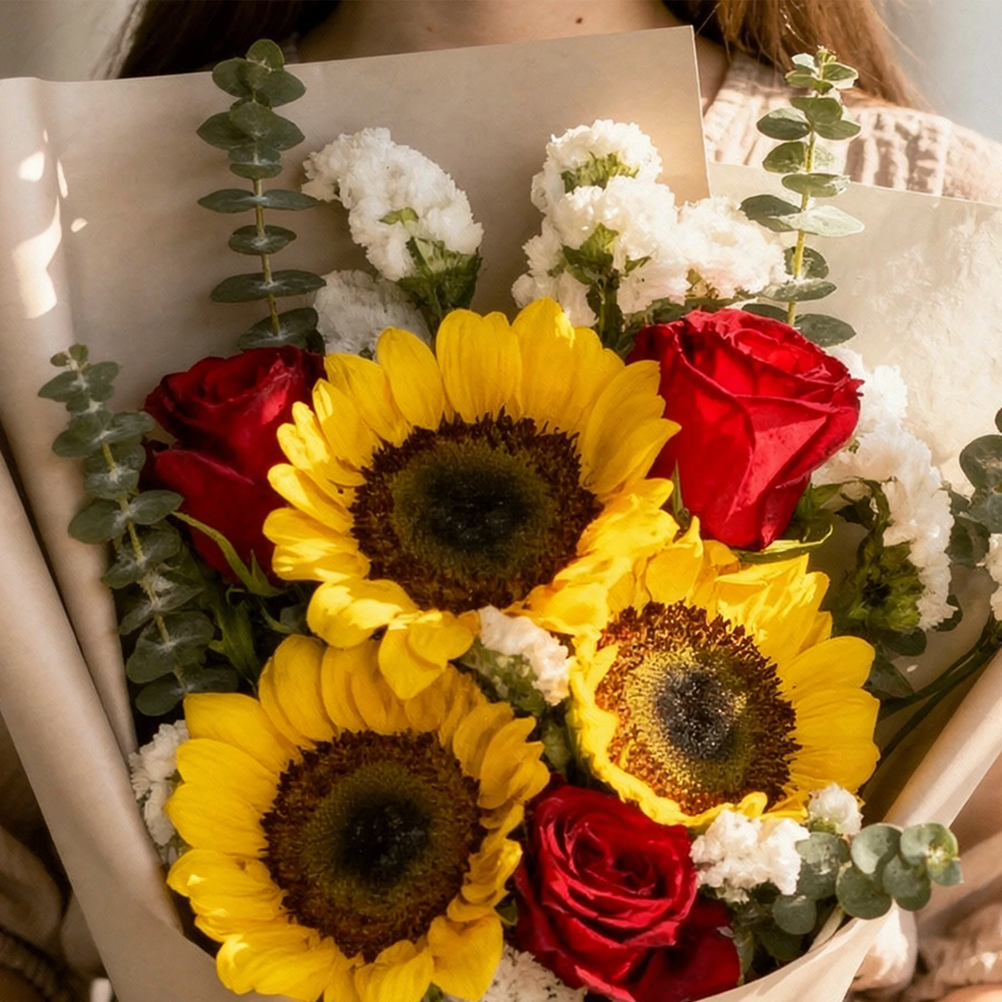 Scarlet Sunshine sunflower bouquet with red roses, white blooms and eucalyptus