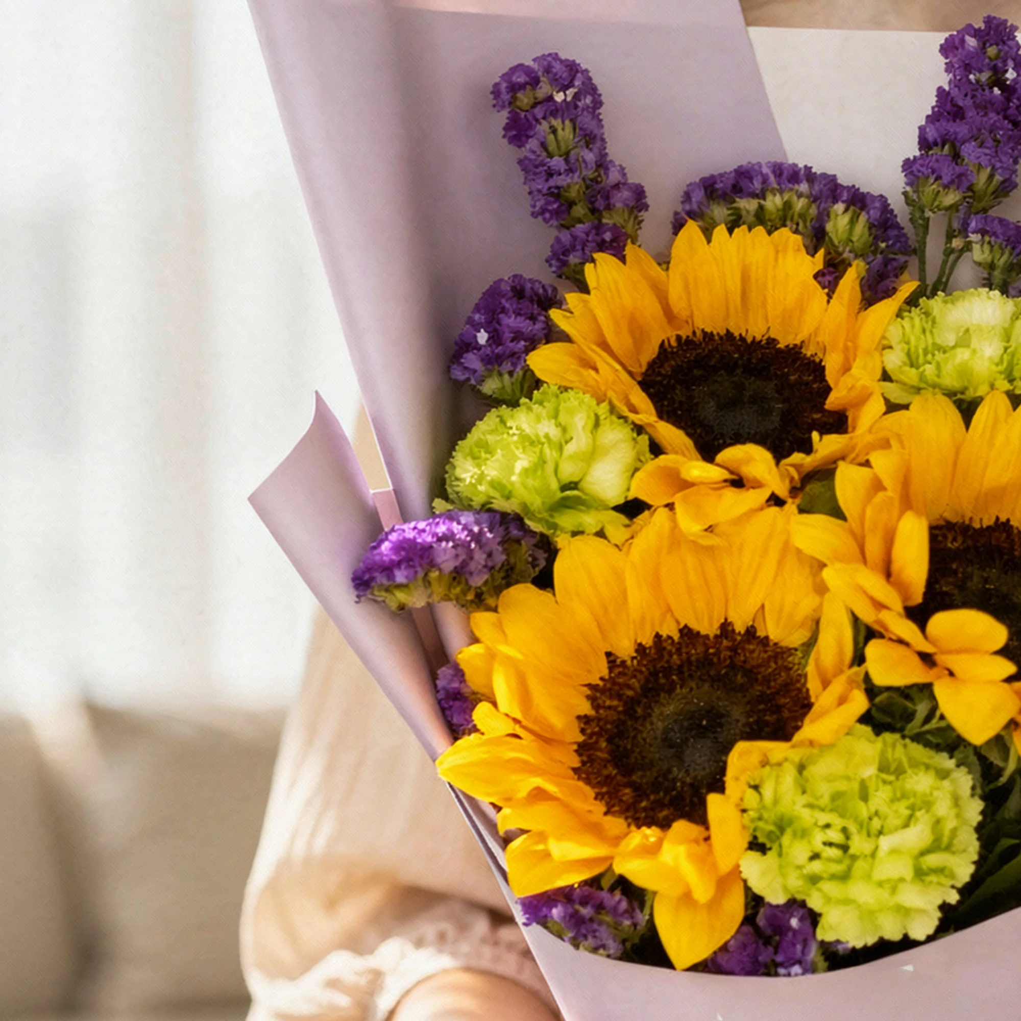 Gold Amethyst Bouquet with sunflowers, green carnations and purple flowers