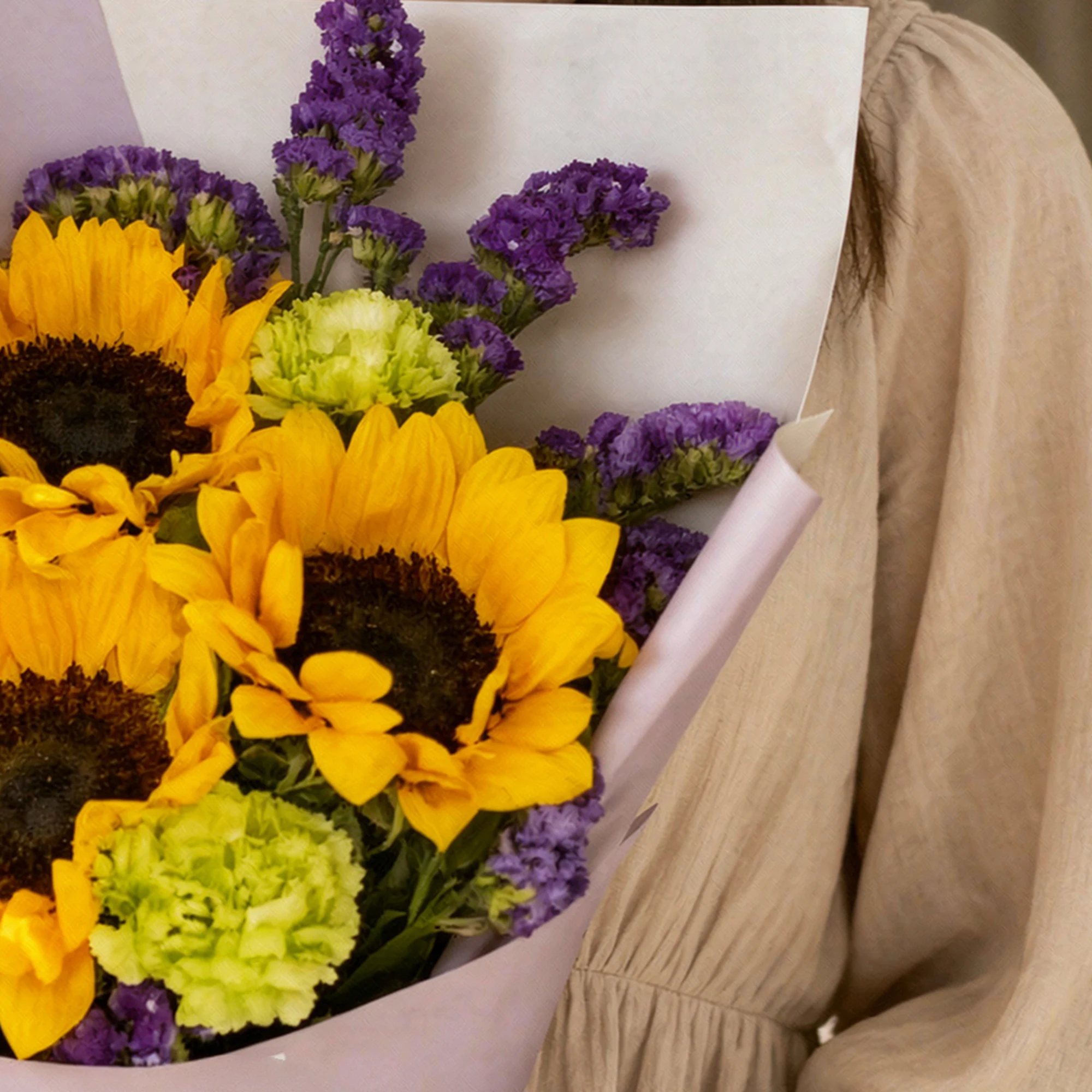 Gold Amethyst Bouquet with sunflowers, green carnations and purple flowers