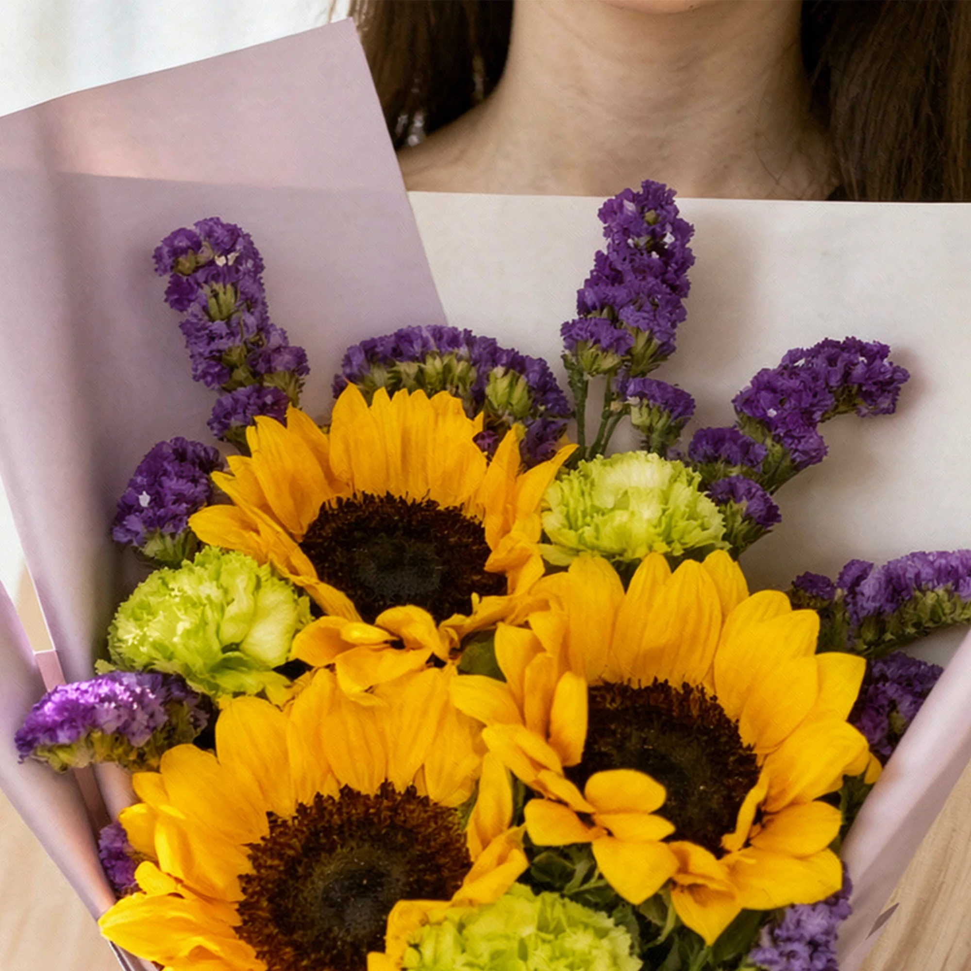 Gold Amethyst Bouquet with sunflowers, green carnations and purple flowers