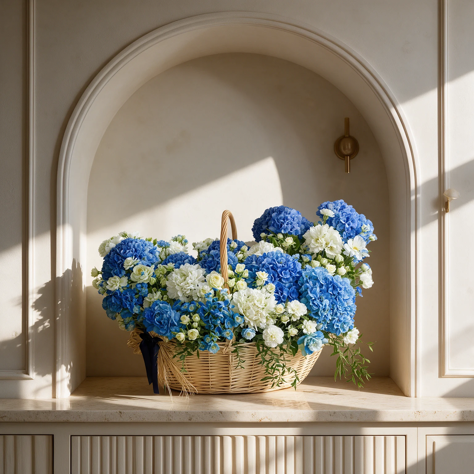 Luxury flower basket featuring 10 blue hydrangeas, 5 white hydrangeas, 30 white spray roses, 30 white carnations and 20 white roses, complemented by decorative green foliage.