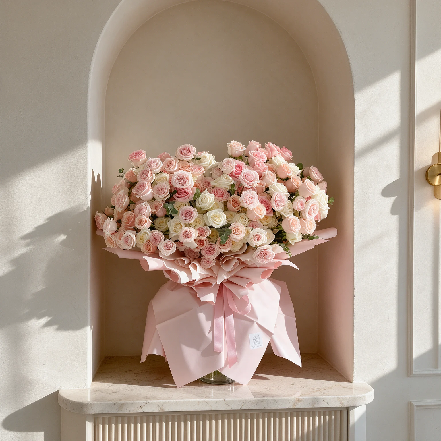 Luxury bouquet of 80 pink and white spray roses arranged together and wrapped in elegant pink paper. Luxury bouquet of 80 pink and white spray roses arranged together and wrapped in elegant pink paper.