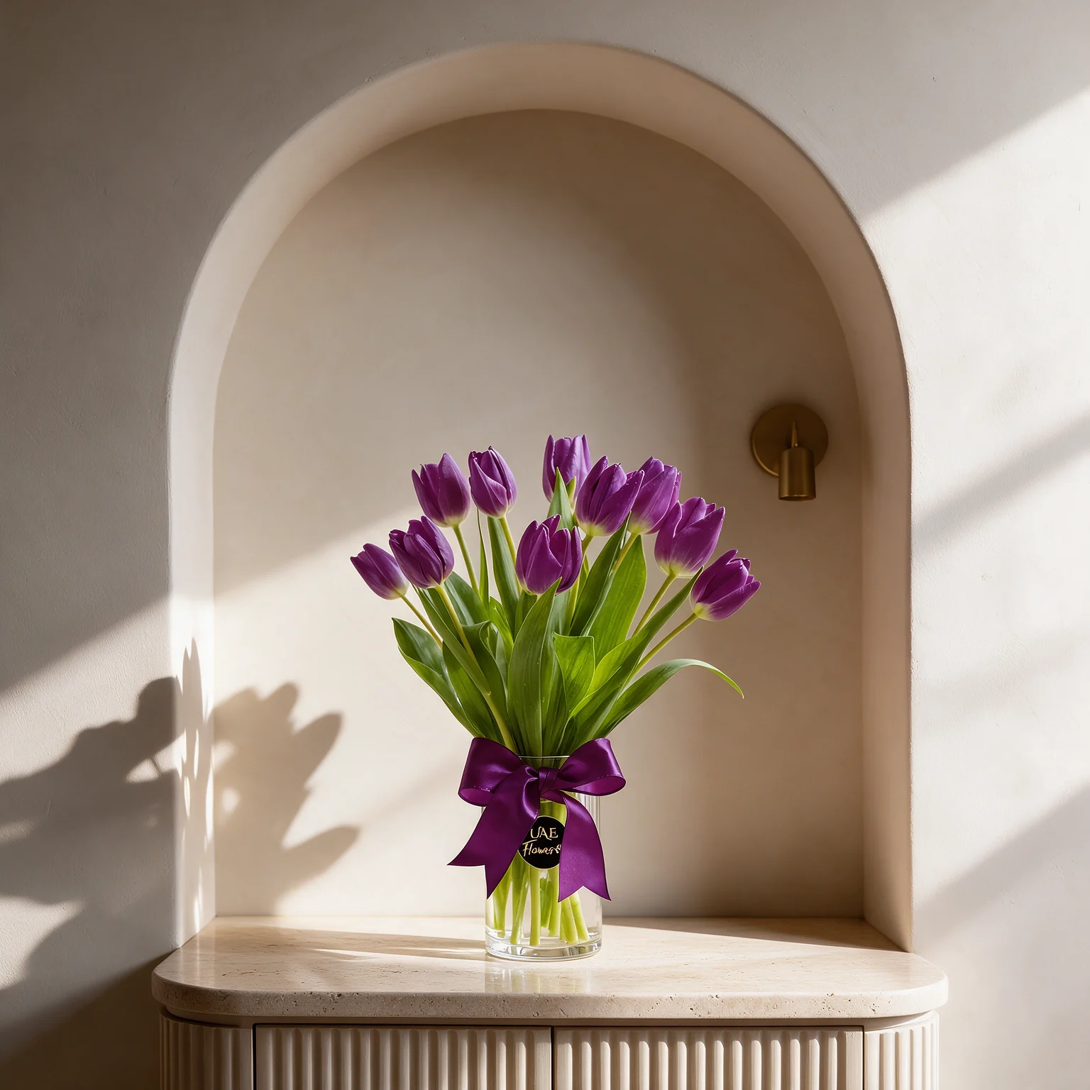 Elegant vase arrangement of 10 fresh purple tulips with green stems, available for same-day flower delivery in Malaysia.